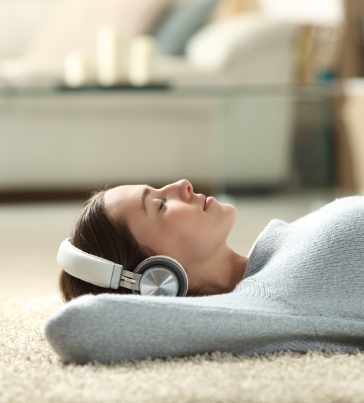 Woman Lying on Back with Headphones